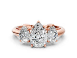 Rose gold Three-Stone Pear Cut Diamond Engagement Ring with Prong Setting on a White Gold Band_42