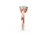 Rose gold Three-Stone Pear Cut Diamond Engagement Ring with Prong Setting on a White Gold Band_8