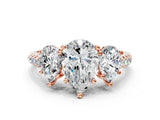Rose gold Three-Stone Pear Cut Diamond Ring with Pavé Band and Prong Setting_89
