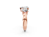 Rose gold Three-Stone Pear Cut Diamond Ring with Round Side Stones, Classic Band, and Four-Prong Setting_5