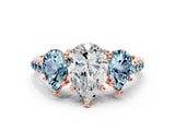 Rose gold Three-Stone Pear Cut Diamond Ring with Round with Aquamarine side stone Pavé Band and Prong Setting