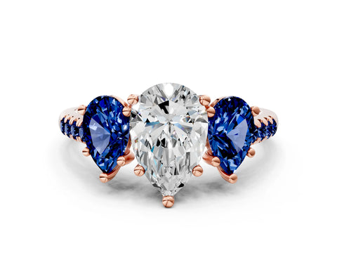 Rose gold Three-Stone Pear Cut Diamond Ring with Round with Blue Sapphire side stone Pavé Band and Prong Setting