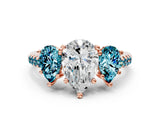 Rose gold Three-Stone Pear Cut Diamond Ring with Round with Blue Topaz side stone Pavé Band and Prong Setting