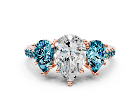 Rose gold Three-Stone Pear Cut Diamond Ring with Round with Blue Topaz side stone Pavé Band and Prong Setting
