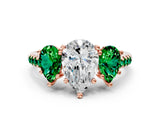 Rose gold Three-Stone Pear Cut Diamond Ring with Round with Emerald side stone Pavé Band and Prong Setting
