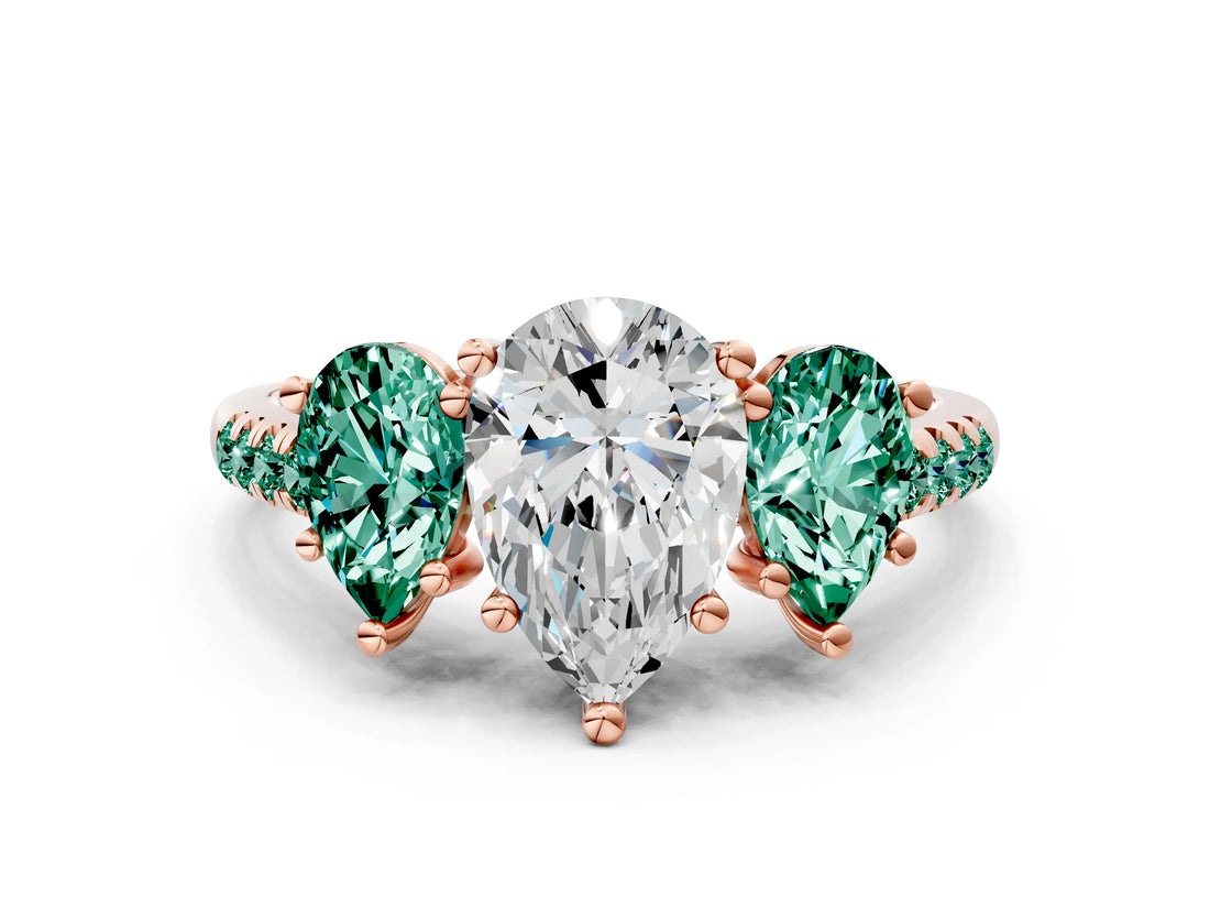 Rose gold Three-Stone Pear Cut Diamond Ring with Round with Green Sapphire side stone Pavé Band and Prong Setting