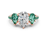 Rose gold Three-Stone Pear Cut Diamond Ring with Round with Green Sapphire side stone Pavé Band and Prong Setting