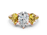 Rose gold Three-Stone Pear Cut Diamond Ring with Round with Yellow Sapphire side stone Pavé Band and Prong Setting