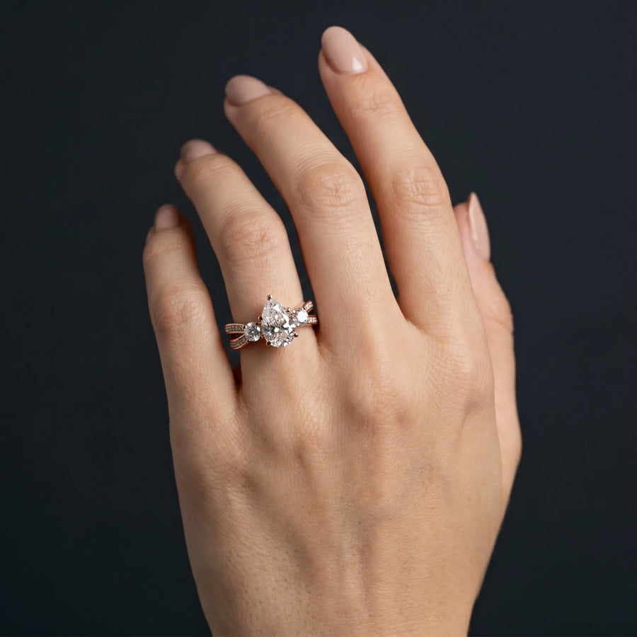 Rose gold Three-Stone Pear Cut Diamond Twist Band with Prong Setting