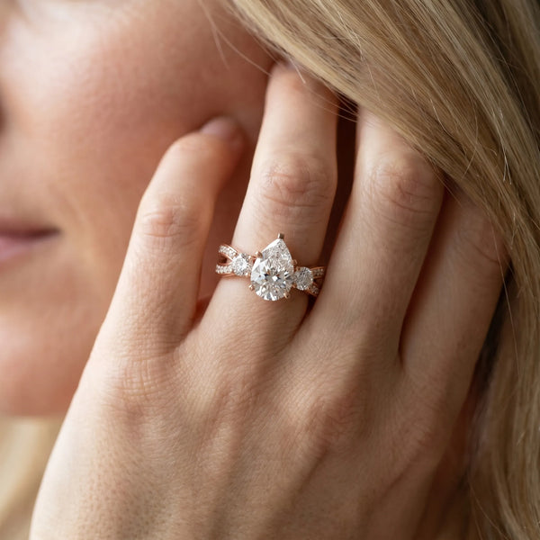 Rose gold Three-Stone Pear Cut Diamond Twist Band with Prong Setting