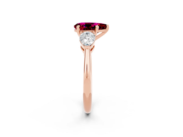 Rose gold Three-Stone Pear Cut Garnet Ring with Pear Side Stones and Four-Prong Setting