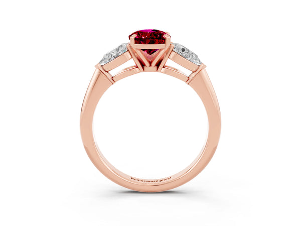 Rose gold Three-Stone Pear Cut Garnet Ring with Pear Side Stones and Four-Prong Setting
