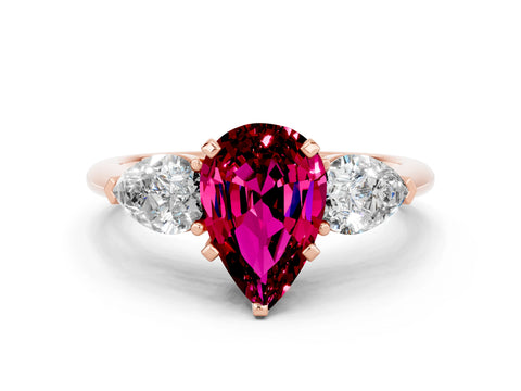 Rose gold Three-Stone Pear Cut Garnet Ring with Pear Side Stones and Four-Prong Setting