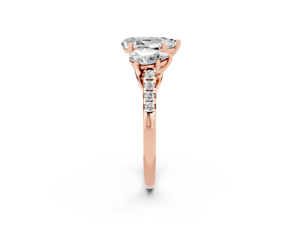 Rose gold Three-Stone Pear Cut Moissanite Ring with Round  Pavé Band and Prong Setting