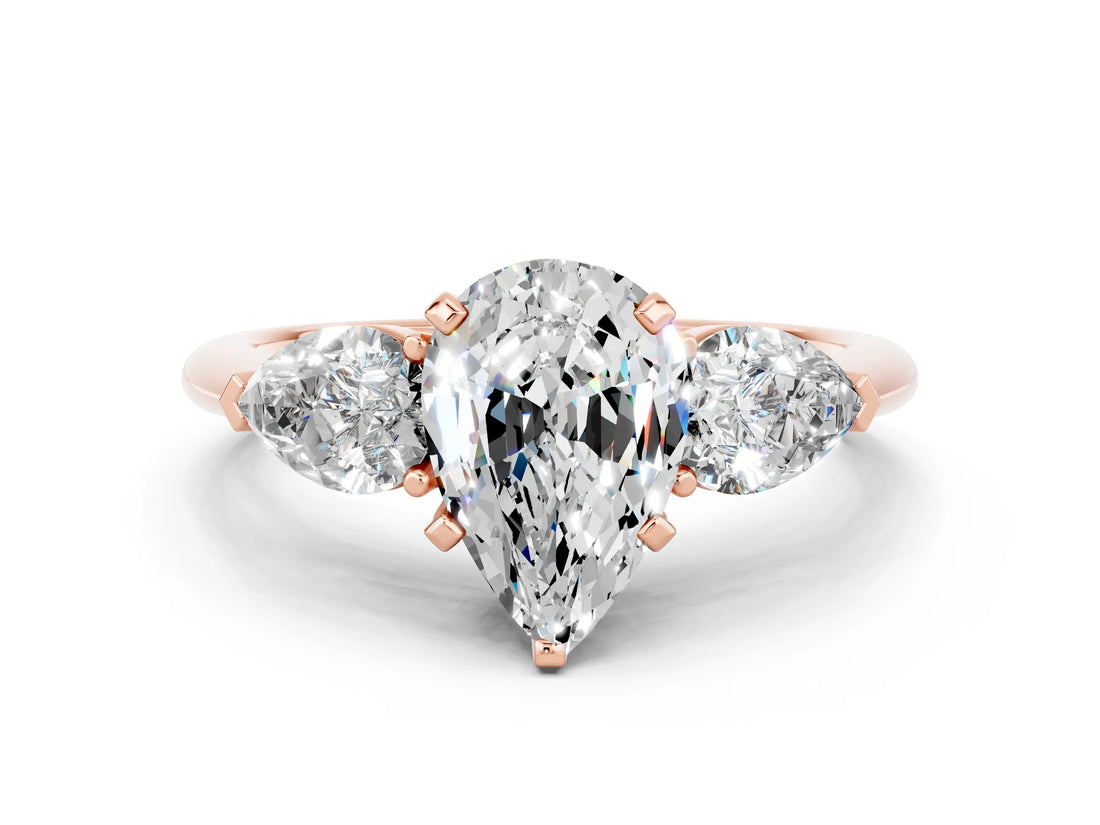 Rose gold Three-Stone Pear Cut Moissanite Ring with Pear Side Stones and Four-Prong Setting