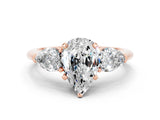 Rose gold Three-Stone Pear Cut Moissanite Ring with Pear Side Stones and Four-Prong Setting