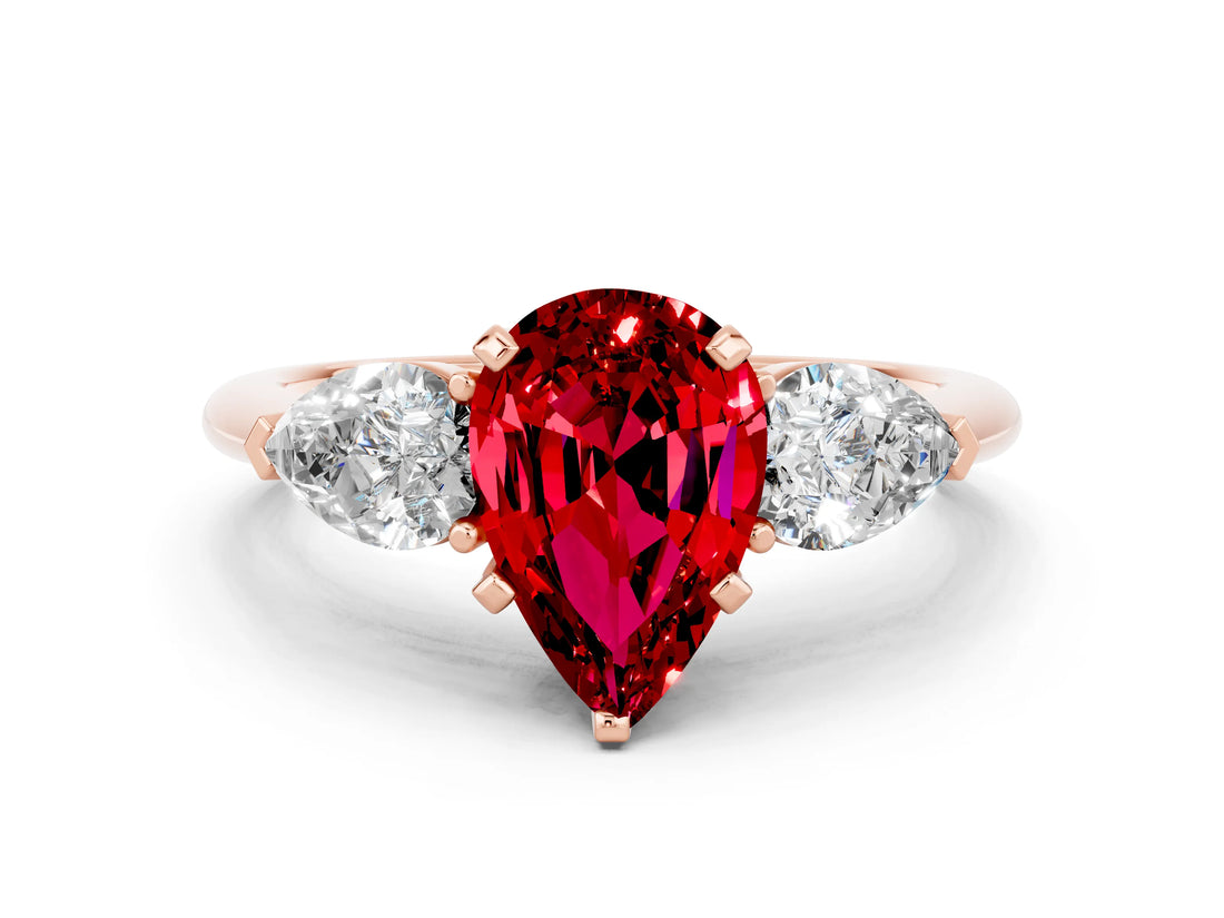 Rose gold Three-Stone Pear Cut Ruby Ring with Pear Side Stones and Four-Prong Setting