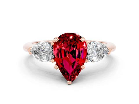 Rose gold Three-Stone Pear Cut Ruby Ring with Pear Side Stones and Four-Prong Setting