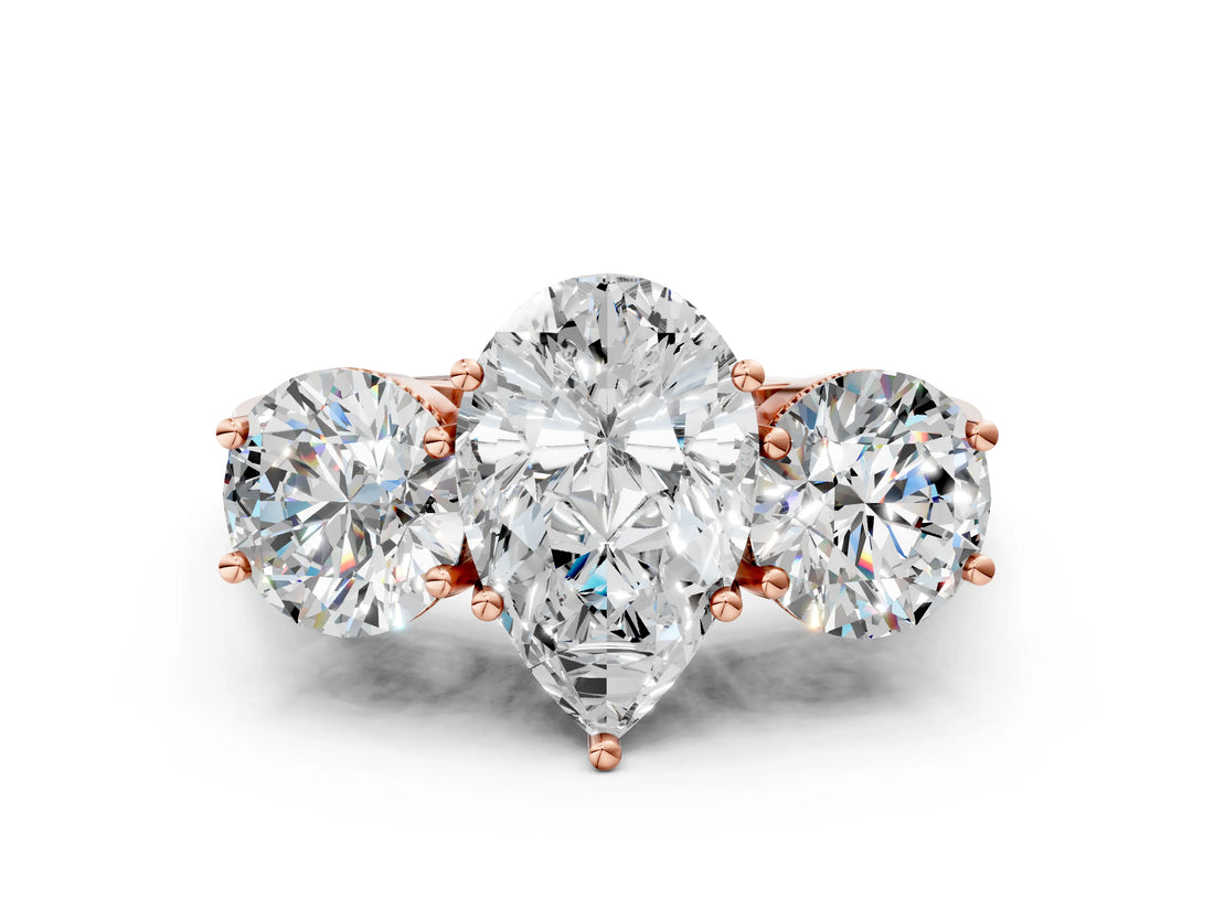 Rose gold Three-Stone Pear Diamond Engagement Ring with Prong Setting on a Classic Band_3