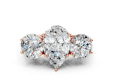 Rose gold Three-Stone Pear Diamond Engagement Ring with Prong Setting on a Classic Band_3