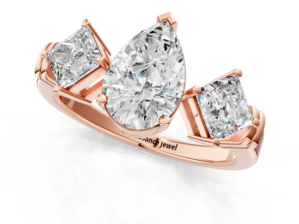 Rose gold Three-Stone Pear and Princess Cut Diamond Ring with Channel Band and Four-Prong Setting