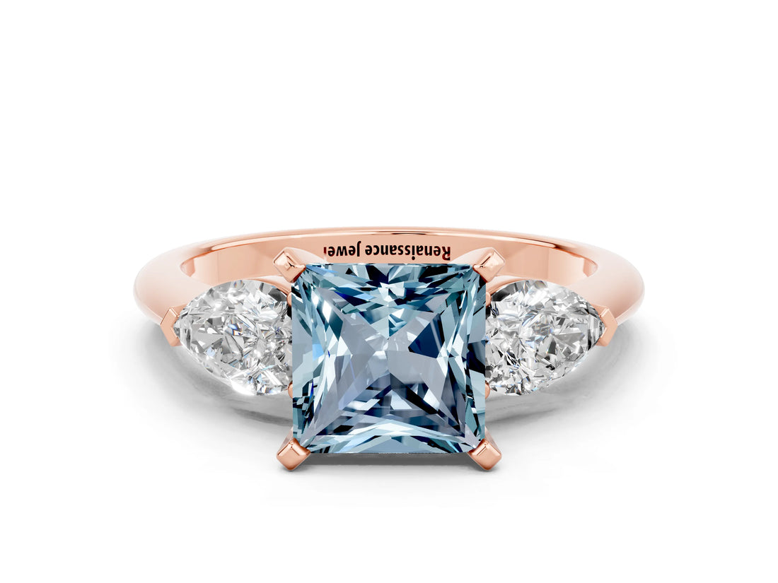 Rose gold Three-Stone Princess Cut Aquamarine Ring with Pear Side Stones and Four-Prong Setting