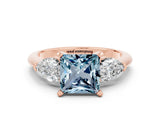 Rose gold Three-Stone Princess Cut Aquamarine Ring with Pear Side Stones and Four-Prong Setting