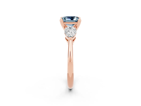 Rose gold Three-Stone Princess Cut Aquamarine Ring with Pear Side Stones and Four-Prong Setting
