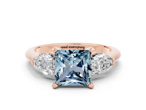 Rose gold Three-Stone Princess Cut Aquamarine Ring with Pear Side Stones and Four-Prong Setting