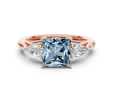 Rose gold Three-Stone Princess Cut Aquamarine Ring with Pear  Side Stones in Four-Prong Setting_12