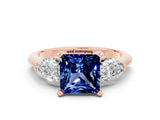 Rose gold Three-Stone Princess Cut Blue Sapphire Ring with Pear Side Stones and Four-Prong Setting