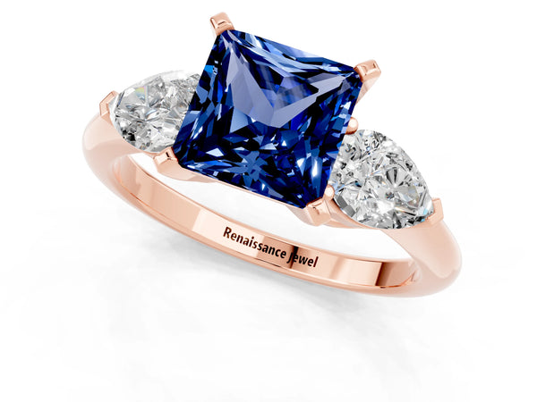 Rose gold Three-Stone Princess Cut Blue Sapphire Ring with Pear Side Stones and Four-Prong Setting