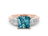 Rose gold Three-Stone Princess Cut Blue Topaz Ring with Pear Side Stones and Four-Prong Setting_12