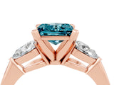 Rose gold Three-Stone Princess Cut Blue Topaz Ring with Pear Side Stones and Four-Prong Setting_16
