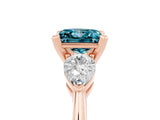 Rose gold Three-Stone Princess Cut Blue Topaz Ring with Pear Side Stones and Four-Prong Setting_17