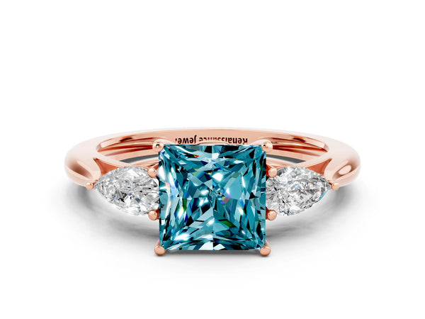Rose gold Three-Stone Princess Cut Blue Topaz Ring with Pear  Side Stones in Four-Prong Setting