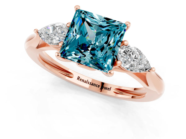 Rose gold Three-Stone Princess Cut Blue Topaz Ring with Pear  Side Stones in Four-Prong Setting