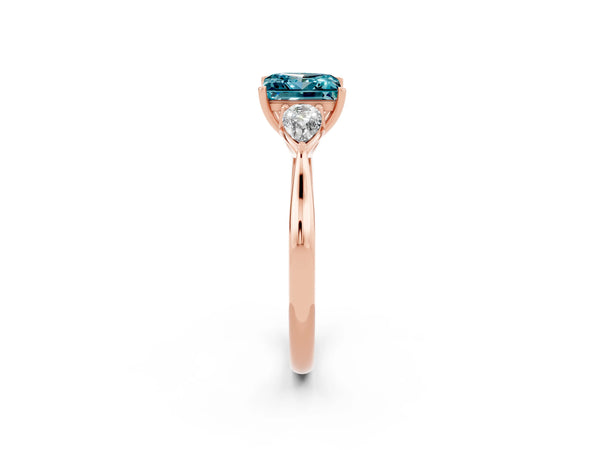 Rose gold Three-Stone Princess Cut Blue Topaz Ring with Pear  Side Stones in Four-Prong Setting