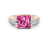 Rose gold Three-Stone Princess Cut Cut Diamond Ring with Trillion Side Stones and Four-Prong Setting