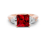 Rose gold Three-Stone Princess Cut Cut Diamond Ring with Trillion Side Stones and Four-Prong Setting