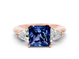 Rose gold Three-Stone Princess Cut Cut Diamond Ring with Trillion Side Stones and Four-Prong Setting