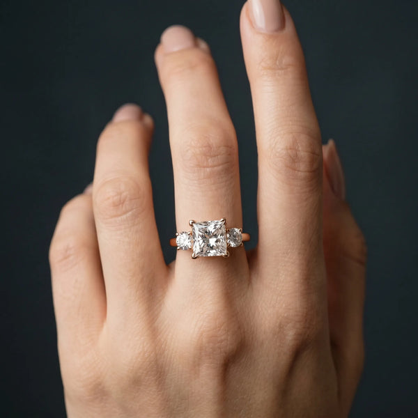 Rose gold Three-Stone Princess Cut Diamond Engagement Ring with Prong Setting on a White Gold Band
