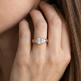 Rose gold Three-Stone Princess Cut Diamond Ring with Trillion Side Stones on a Split Shank Band_9