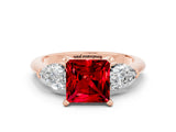 Rose gold Three-Stone Princess Cut Ruby Ring with Pear Side Stones and Four-Prong Setting