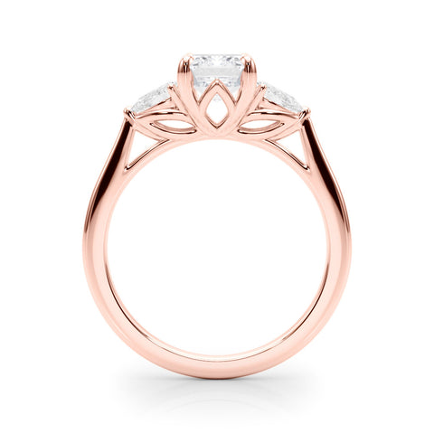 Rose gold Three-Stone Radiant Cut Diamond Ring with Pear Side Stones on a Platinum Band and Four-Prong Setting