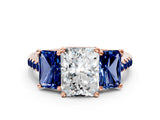 Rose gold Three-Stone Radiant Cut Diamond Ring with Round with Blue Sapphire side stone Pavé Band and Prong Setting