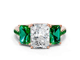 Rose gold Three-Stone Radiant Cut Diamond Ring with Round with Emerald side stone Pavé Band and Prong Setting