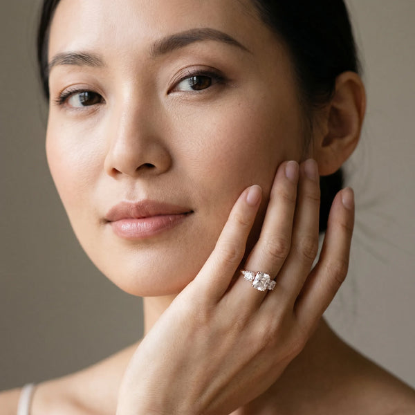 Rose gold Three-Stone Radiant Diamond Engagement Ring with Prong Setting on a Classic Band