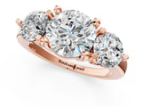 Rose gold Three-Stone Round Brilliant Cut Solitaire Ring with Prong Setting on a Classic Band 1