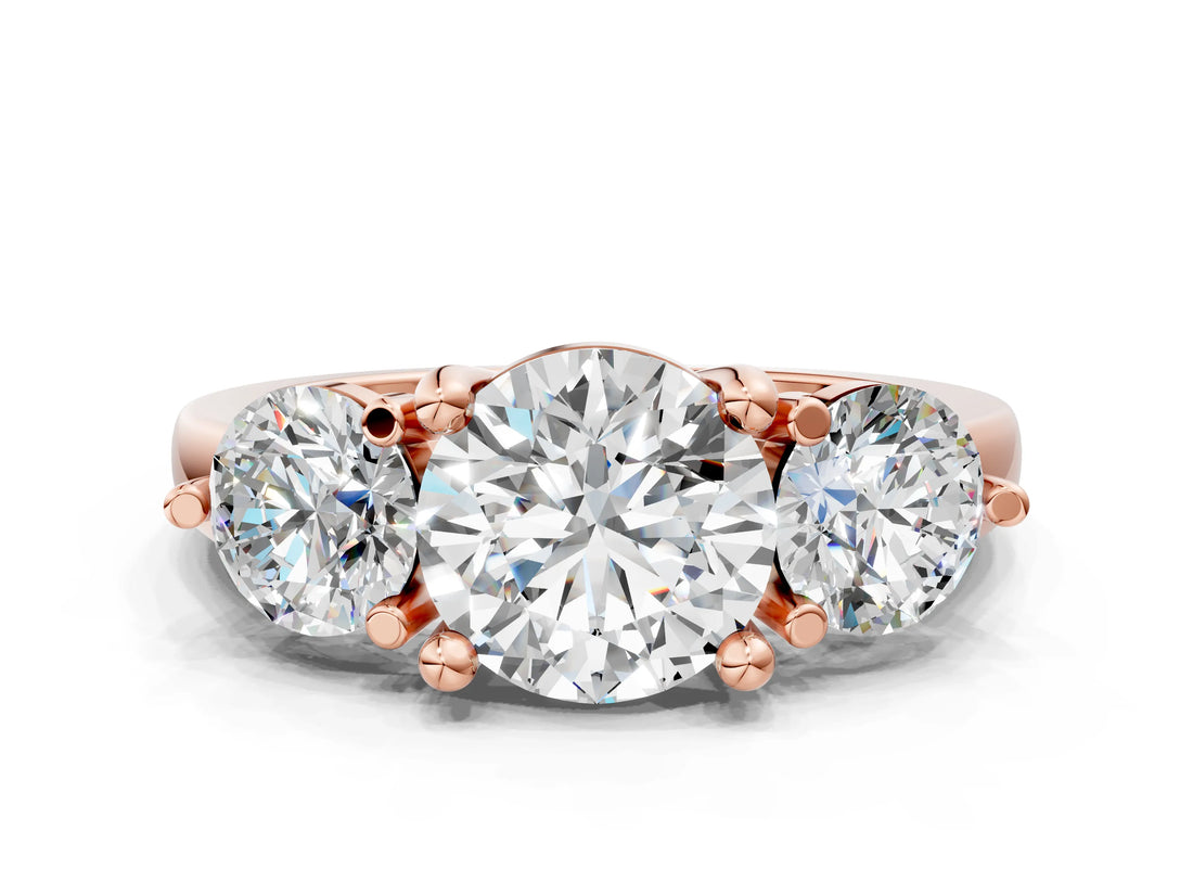 Rose gold Three-Stone Round Brilliant Cut Solitaire Ring with Prong Setting on a Classic Band